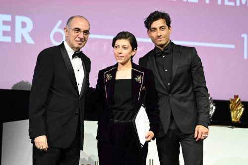 Darin Sallam (C) is presented the Competition Special Mention award for 'Farha' by Giuseppe Tornatore (L) and Rob Raco (R) at the closing night Award Ceremony at The Red Sea International Film Festival on December 13, 2021 in Jeddah, Saudi Arabia [Daniele Venturelli/Getty Images for The Red Sea International Film Festival]