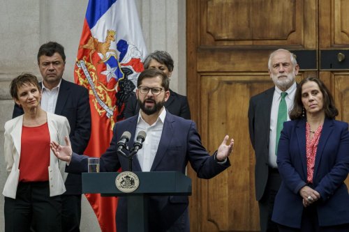 President of Chile Gabriel Boric (C) speaks at the end of the ceremony for the presentation of new Ministers at the Palacio de La Moneda on September 6, 2022 in Santiago, Chile. [Photo by Sebastián Vivallo Oñate/Agencia Makro/Getty Images]