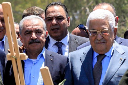 Palestinian president Mahmud Abbas (C-R) and Prime Minister Mohammad Shtayyeh (C-L) arrive to lay a wreath of flowers by the graves of Palestinians killed in recent Israeli military raids on the Jenin camp, north of the occupied West Bank on July 12, 2023 [ZAIN JAAFAR/AFP via Getty Images]