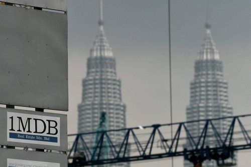 The 1 Malaysia Development Berhad (1MDB) logo is seen on a billboard at the funds flagship Tun Razak Exchange under-development site in Kuala Lumpur on July 3, 2015 [MANAN VATSYAYANA/AFP via Getty Images]