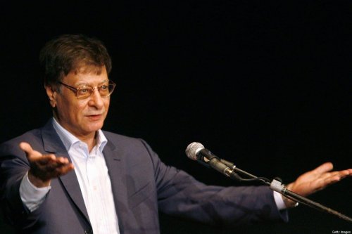 Late Palestinian poet and journalist Mahmoud Darwish gestures during his show in the northern Israeli city of Haifa, 15 July 2007 [GIL COHEN MAGEN/AFP via Getty Images]