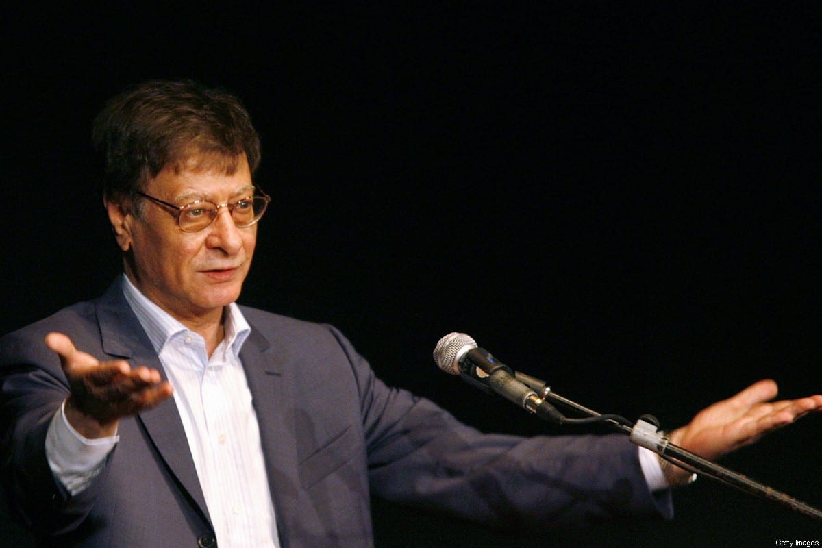 Late Palestinian poet and journalist Mahmoud Darwish gestures during his show in the northern Israeli city of Haifa, 15 July 2007 [GIL COHEN MAGEN/AFP via Getty Images]