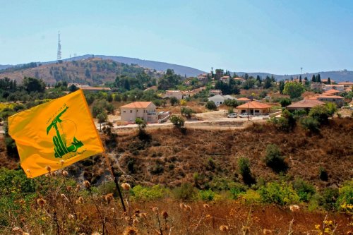 A Hezbolla flag flutters in Lebanon on 2 September 2019 [MAHMOUD ZAYYAT/AFP/Getty Images]