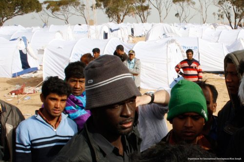 Migrants can be seen at a shelter in Libya [Department for International Development/Kate Joseph]