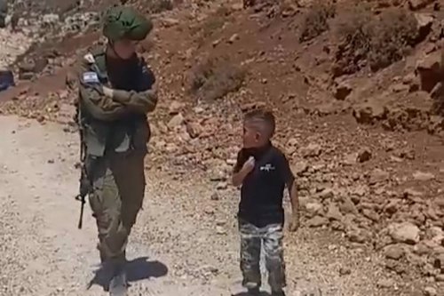 Palestinian boy to Israeli soldier: This is my land