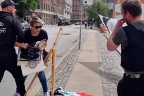 Thumbnail - Woman tries to stop Quran Burning in Denmark