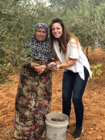 Elizabeth Kassis is picking olives