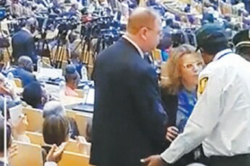 Israeli Ambassador Sharon Bar-Li being escorted out of the opening ceremony of the African Union Summit in Addis Ababa on 18 February [Twitter]